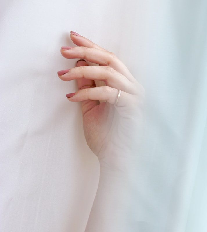 woman wearing gold-colored ring