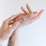 two hands reaching up towards each other