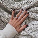 a woman's hand on a blanket