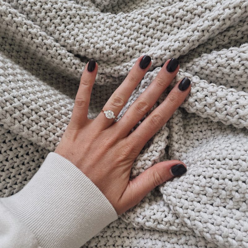 a woman's hand on a blanket